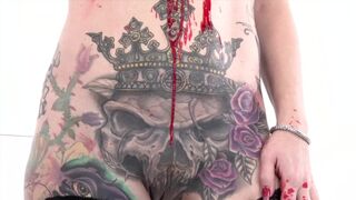 Tattooed babe Marie Bossette covers herself in hot wax