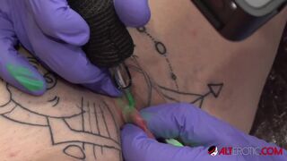 Inked up hottie Sully Savage has her clit tattooed