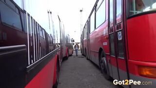 Hot Blonde Pees Between Two Buses