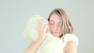 Hot naked blonde cuddling her teddy bear