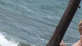 Busty teen Malina get wetting in waves
