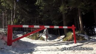 Girls in need skate around in the snow to find a proper place to have a pee