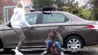 Reckless girls managed to find a sweet spot to piss between parked cars