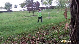 Amateur Brunette Stands And Pees Over The Grass