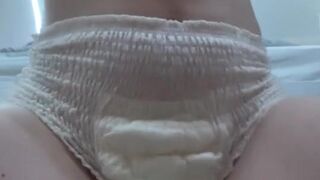 Horny teen wets overflowing diaper