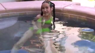 Tiny Tabby Masturbating her pussy using dildo at the pool