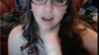 Nerdy Chick with glasses sucking dildo