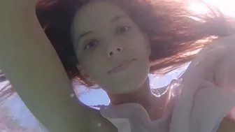 Russian babe shows pussy under the water
