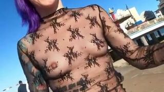 See through top on busy beach street tits on display