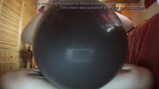 A huge black balloon will be used as if it were a big hard cock!