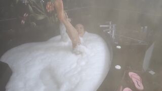 THE SENSUAL MILF GODDESS COMES OUT OF THE SAUNA VERY SWEATY AND GETS WET IN FOAM
