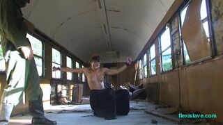 Bdsm model Alex Zothberg nude, oiled, captive and whipped in train