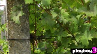 Asian housekeeper posed in the vineyard