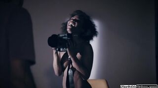 Photographer makes an ebony model squirt