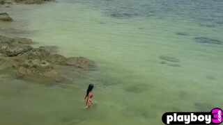 Petite Asian teen posed on the beach