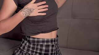Girl in a plaid skirt stretches her ass and gets an orgasm