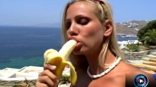 Extreme chick Sandy proudly shows a banana stuffed on her oiled cunt
