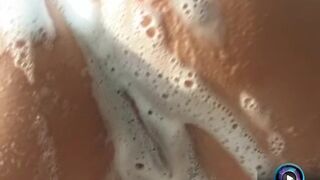 Maria Belucci gets wet and soaped up with her luscious tits and cunt