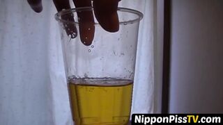 Delightful Japanese chick sits on the latrine and pees in a cup