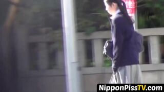 Flavorful Japanese angel is peeing outside during day time