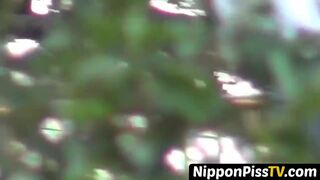 Entrancing Japanese young lady peeing rapidly outside during day