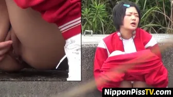 Short Haired Japanese Darling In Tracksuit Pees In The Road