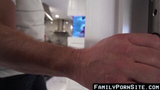 Young stepson gets a blowjob from a horny stepdad in the kitchen