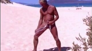 Tanned guy on beach in tiny string thong (temporarily!)