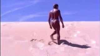 Tanned guy on beach in tiny string thong (temporarily!)