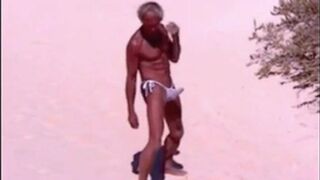 Tanned guy on beach in tiny string thong (temporarily!)