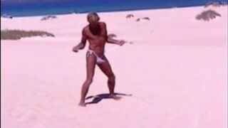 Tanned guy on beach in tiny string thong (temporarily!)