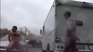 Public Rainy Stroking in a Parking Lot by Two Horny Men