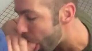 Hunk gives blowjob in a public restroom - amateur gay porn