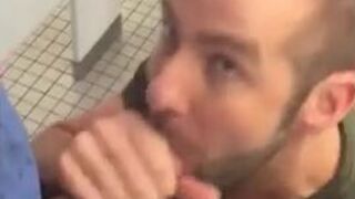 Hunk gives blowjob in a public restroom - amateur gay porn