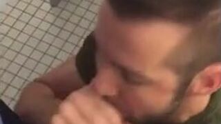 Hunk gives blowjob in a public restroom - amateur gay porn