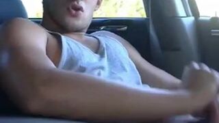 Big-cock jock strokes in his car