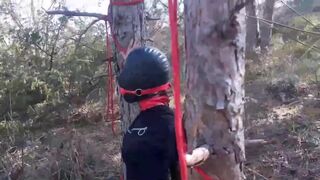 tied to a tree,  rammed in her throat