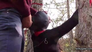 tied to a tree,  rammed in her throat