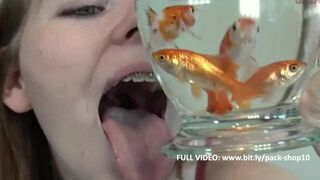 Pretty hungry girl swallows innocent fish - Vore