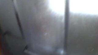 Hot slut masturbates in the shower