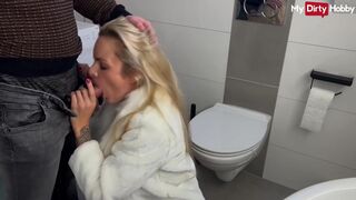 German blonde babe gets picked up and rides a dick in the bathroom