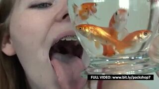 Pretty hungry girl swallows innocent fish - Vore