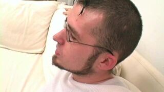 Twink wears sexy glasses while jerking off his thick cock