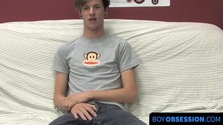 On a couch by himself cute gay man Danny jerks off his dick