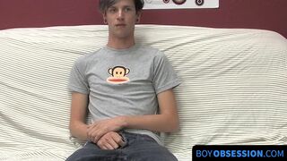 On a couch by himself cute gay man Danny jerks off his dick