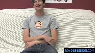 On a couch by himself cute gay man Danny jerks off his dick