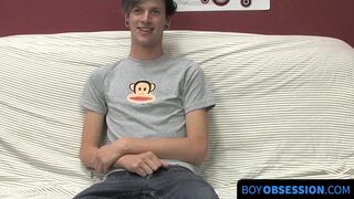 On a couch by himself cute gay man Danny jerks off his dick