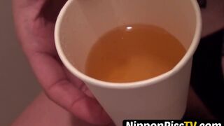 Japanese dollface tops a cup off with her pee and records it