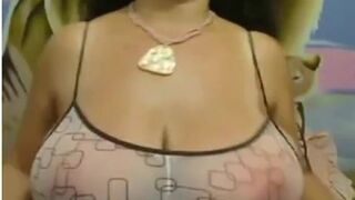 Big-Breasted Black Mature Woman Shows Off on Webcam