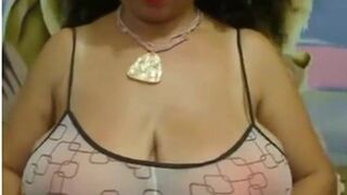 Big-Breasted Black Mature Woman Shows Off on Webcam